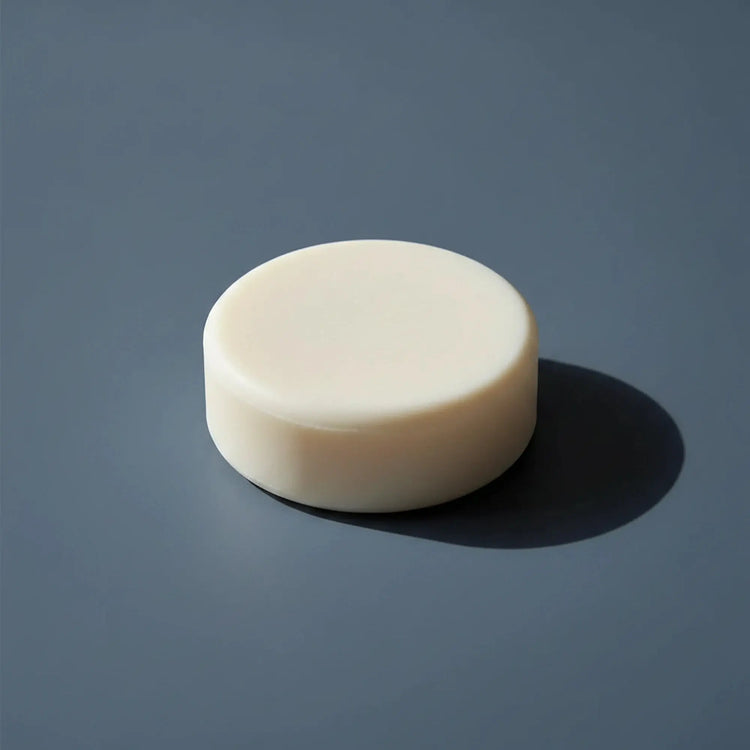 Still Water | Unscented Tallow Shampoo Bar Blind Pirate Trading Co. All white tallow shampoo bar, hockey puc round.