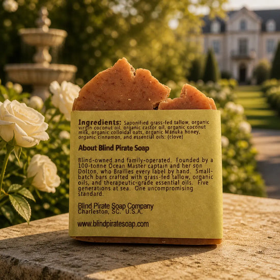 Oatmeal & Honey tallow soap bar, ingredients panel facing out, warm golden estate stable yard light. Blind Pirate Trading Co.