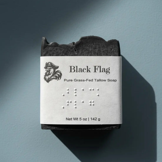 Black Flag | Grass Fed Tallow Soap Bar Blind Pirate Trading Co. Label is brailled with the name of the soap