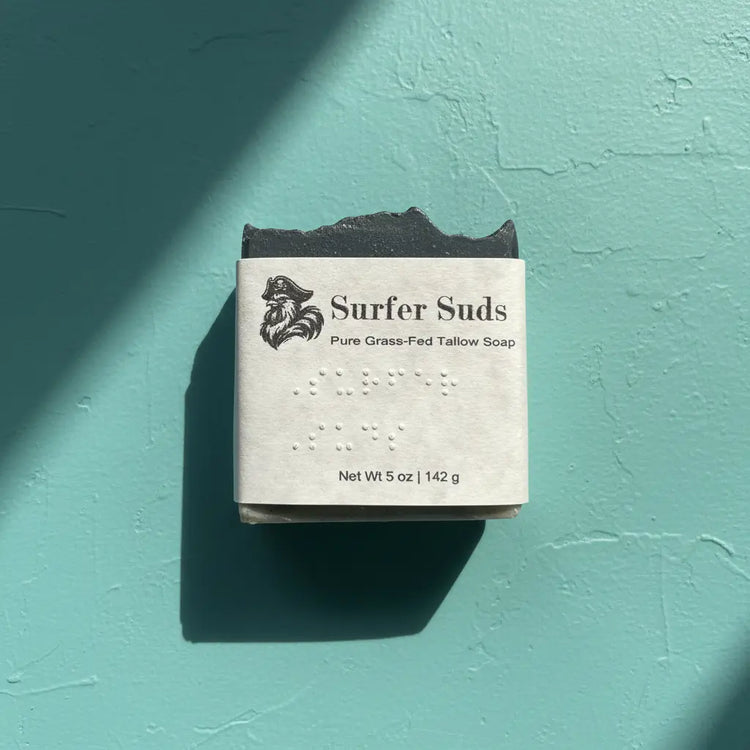 Surfer Suds — Blind Pirate Trading Co. with full label and braille on the front of the label.