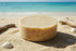 Beach Rain | Grass Fed Tallow | Shampoo Bar Blind Pirate Trading Co. full passage round bar on the beach near the ocean.